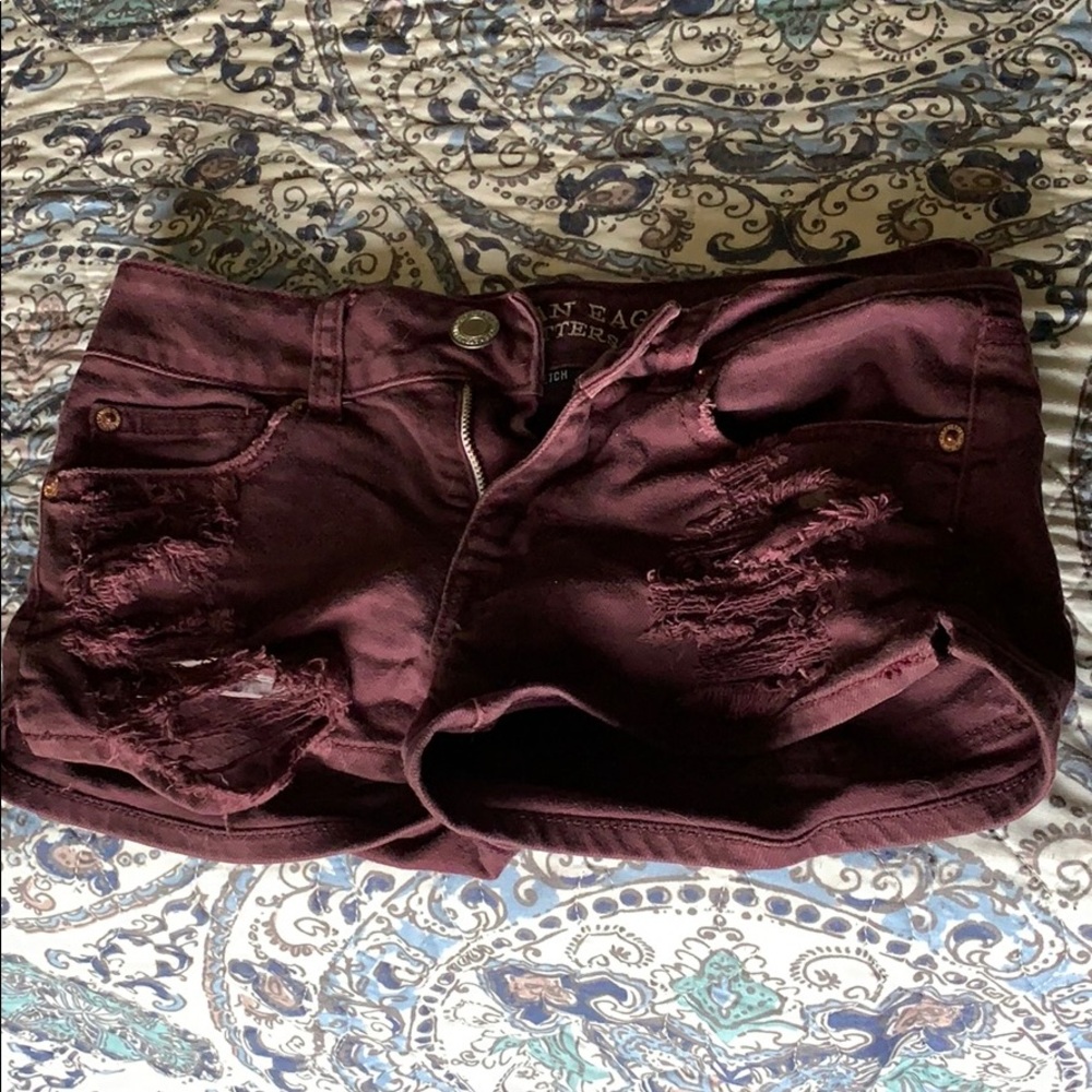 Distressed maroon denim shorts
